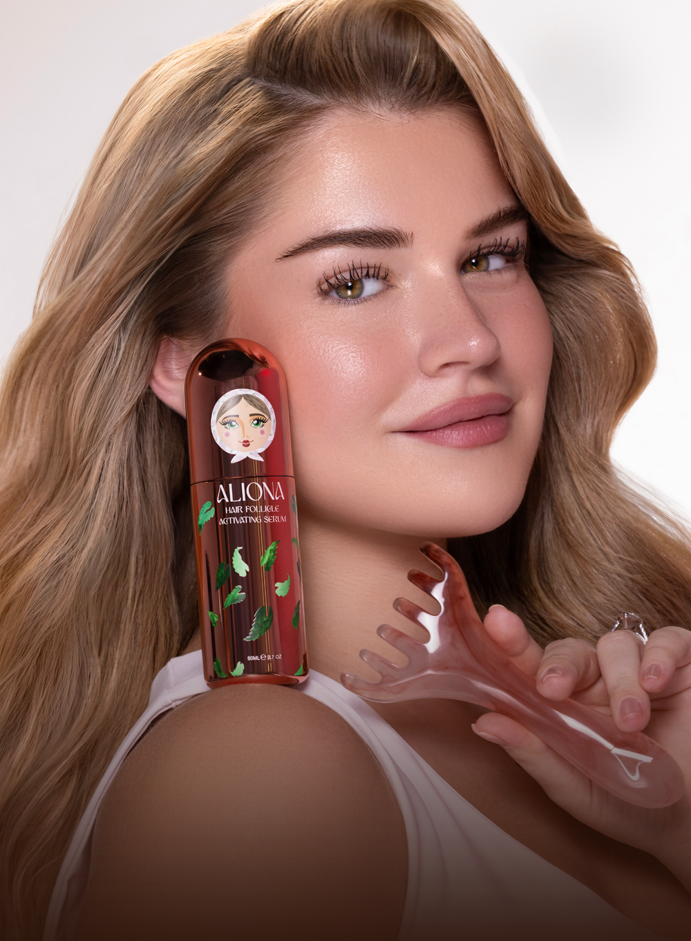 Woman holding a bottle of Alpina skincare product with a blurred face